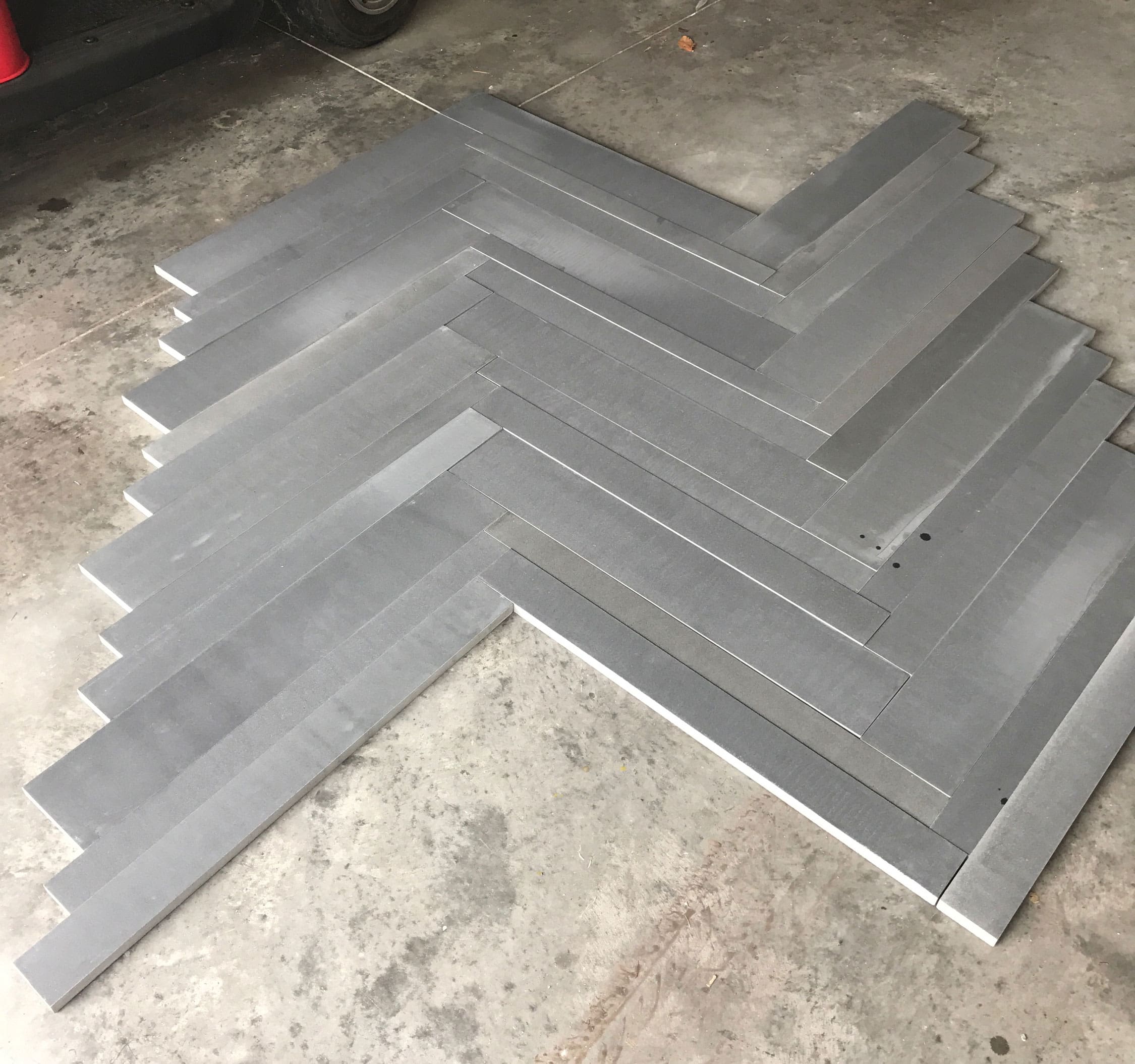 Norstone Planc in Basalt Grey laid out in a herringbone pattern